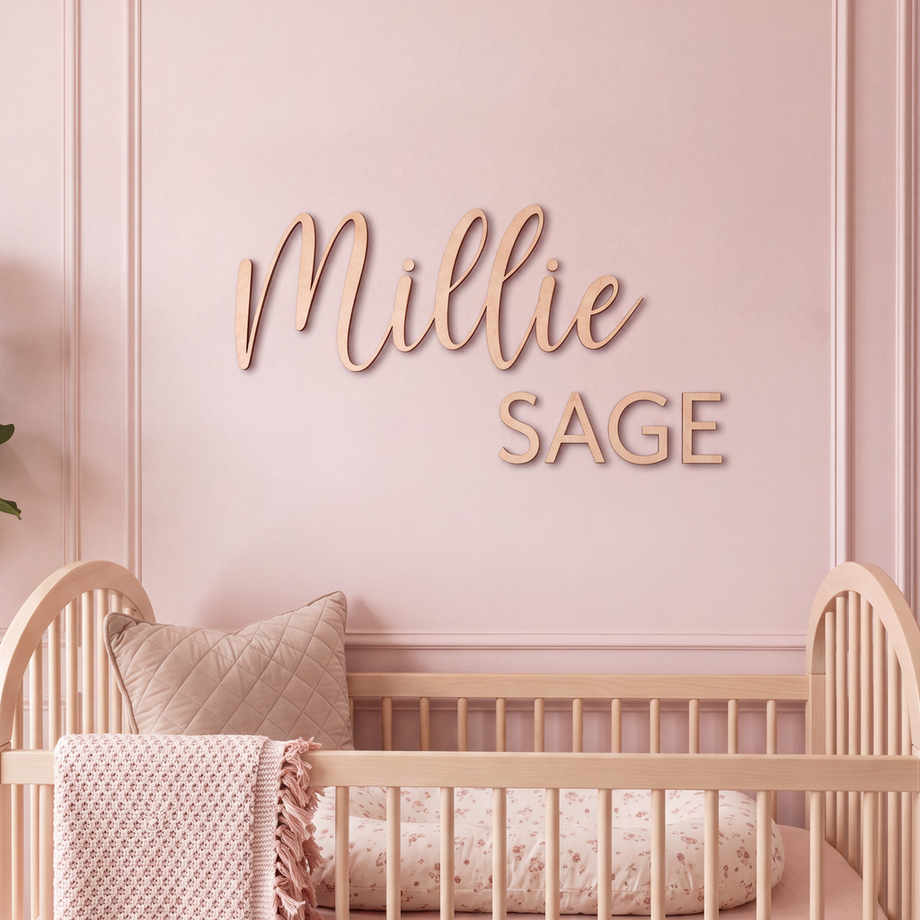 Close-up of the Millie Sage name sign in script with a block capital middle name