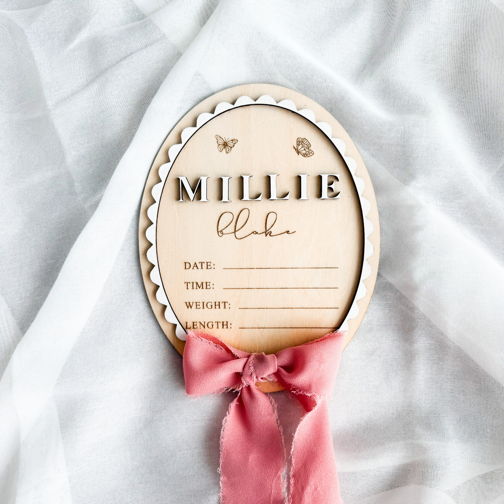 Scalloped birch basswood birth stats sign with blank date, time, weight and length lines and a rose ribbon