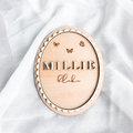 Layered scalloped birch basswood name sign with raised Millie lettering and engraved butterflies